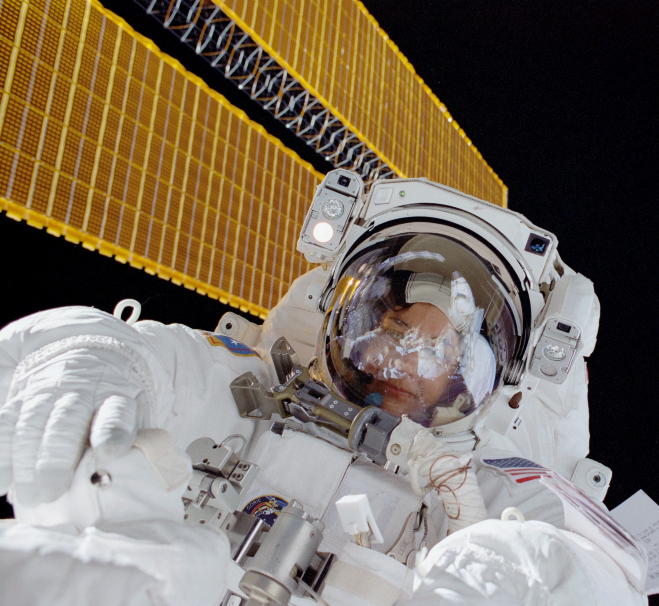 Godwin during STS-108, the first woman to complete spacewalks at Mir and the space station