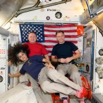 Expedition 72 Commander Suni Williams and Flight Engineers Butch Wilmore and Nick Hague, all three NASA astronauts, pose for a portrait together with the U.S. flag behind them aboard the International Space Station's Harmony module. The trio was honoring veteran members of the U.S. Armed Forces during Veterans Day. Williams is a retired U.S. Navy captain, Wilmore is a U.S. Navy test pilot, and Hague is U.S. Space Force colonel.