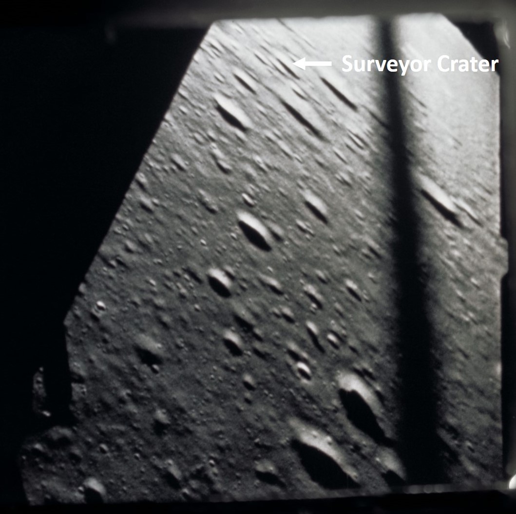 Still from 16 mm film looking out Alan L. Bean's window at about 3,500 feet during the descent, showing the location of Surveyor Crater, the Apollo 12 landing site