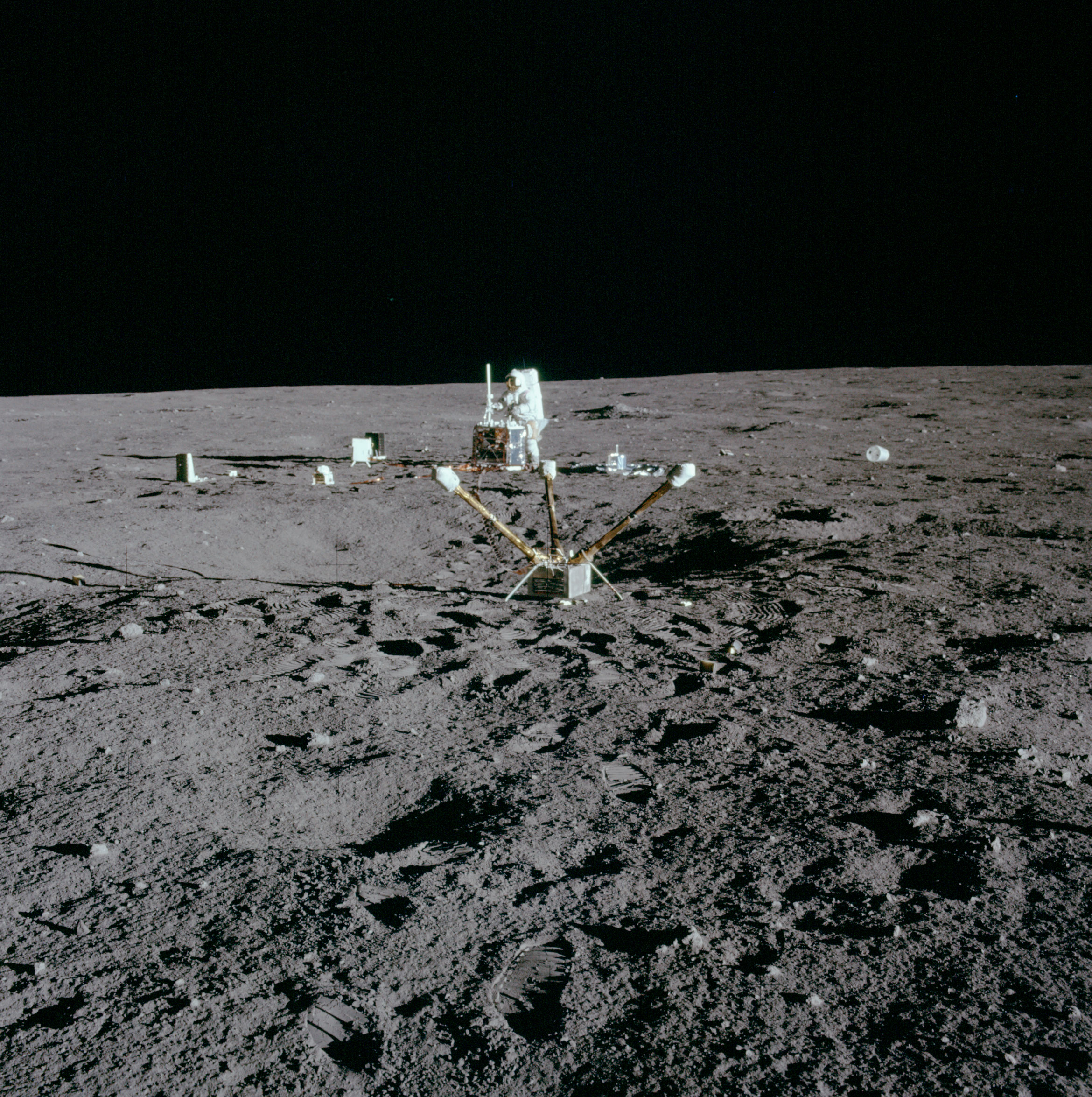 Conrad working on the central station of the Apollo Lunar Surface Experiment Package