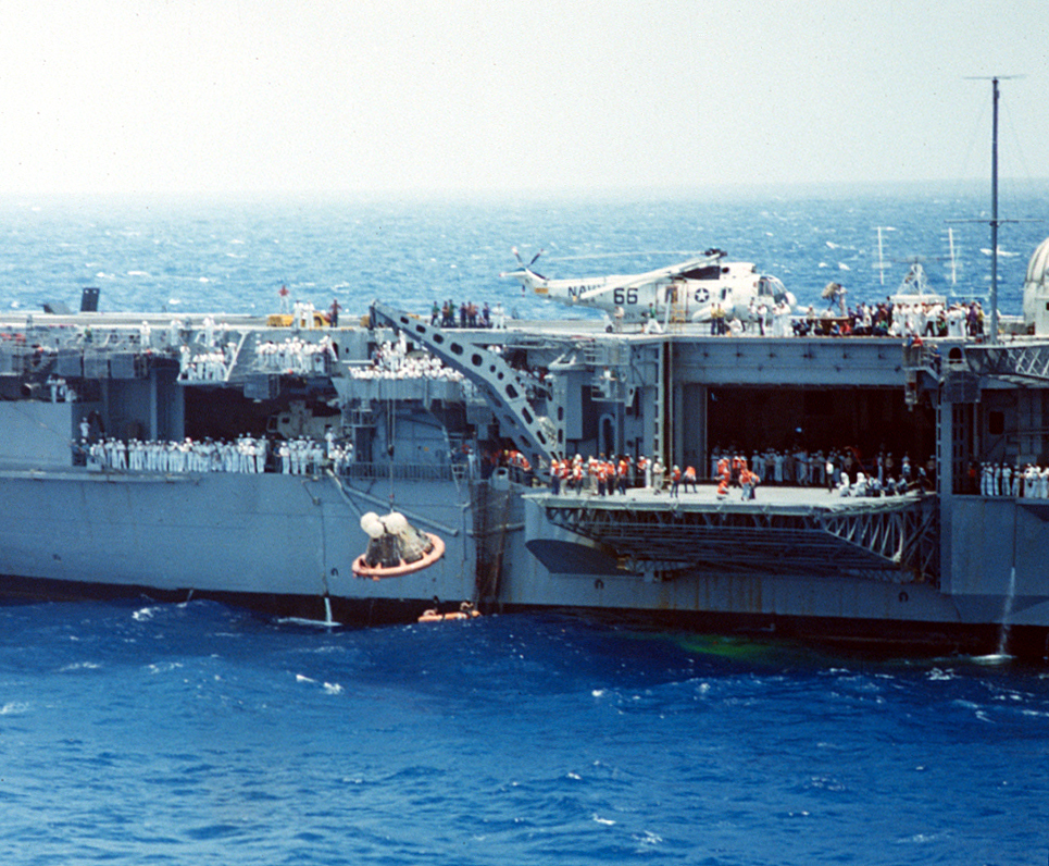 Recovery team members lift Yankee Clipper out of the water