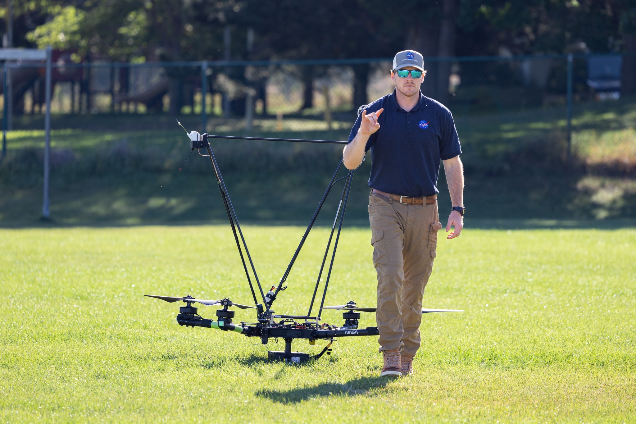 UAS Pilot in Command Brayden Chamberlain flashes a ‘good to go’ signal to the command tent, indicating that the NASA Alta X quadcopter is prepped for takeoff.