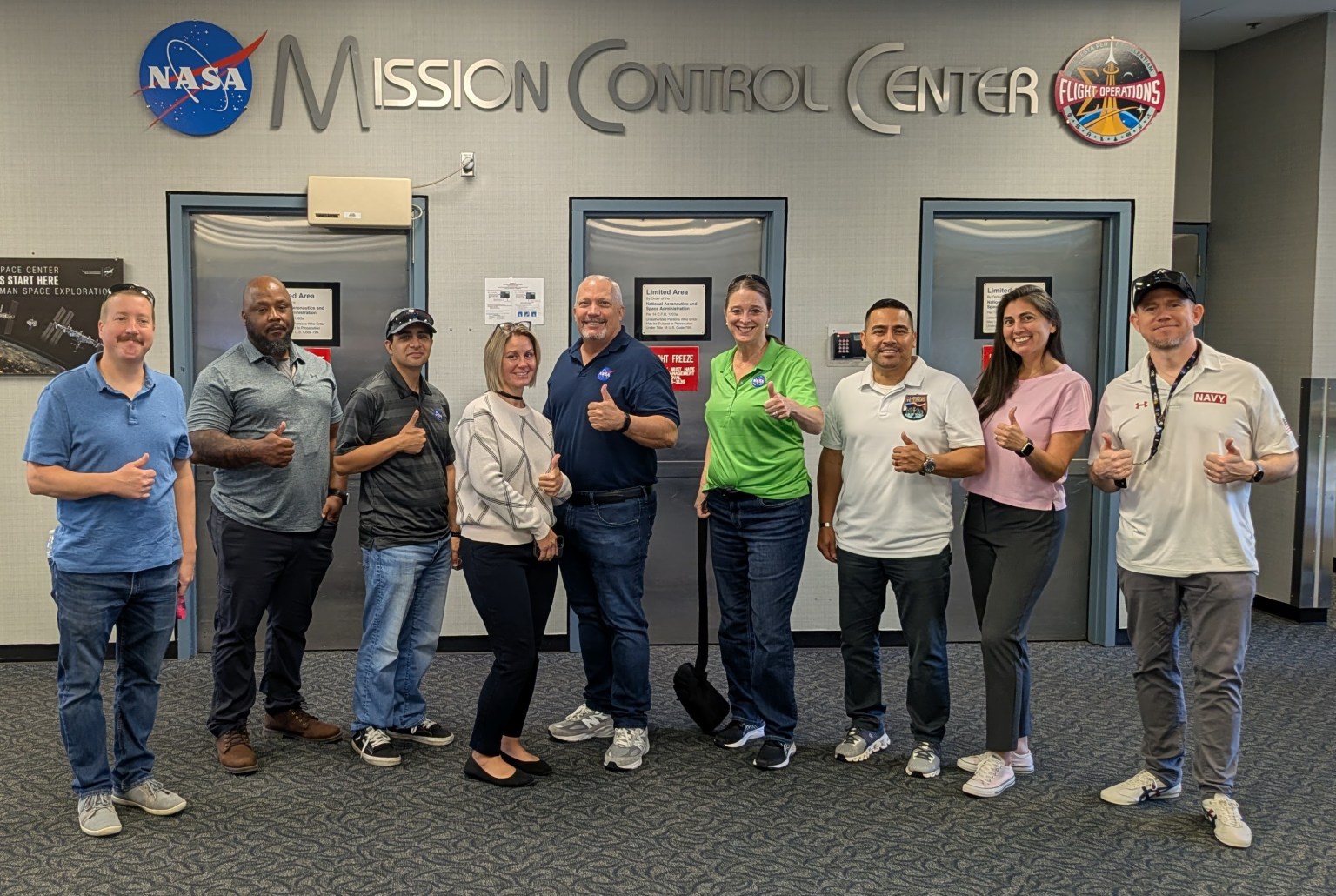 Group photo of NASA SkillBridge employees at JSC Mission Control.