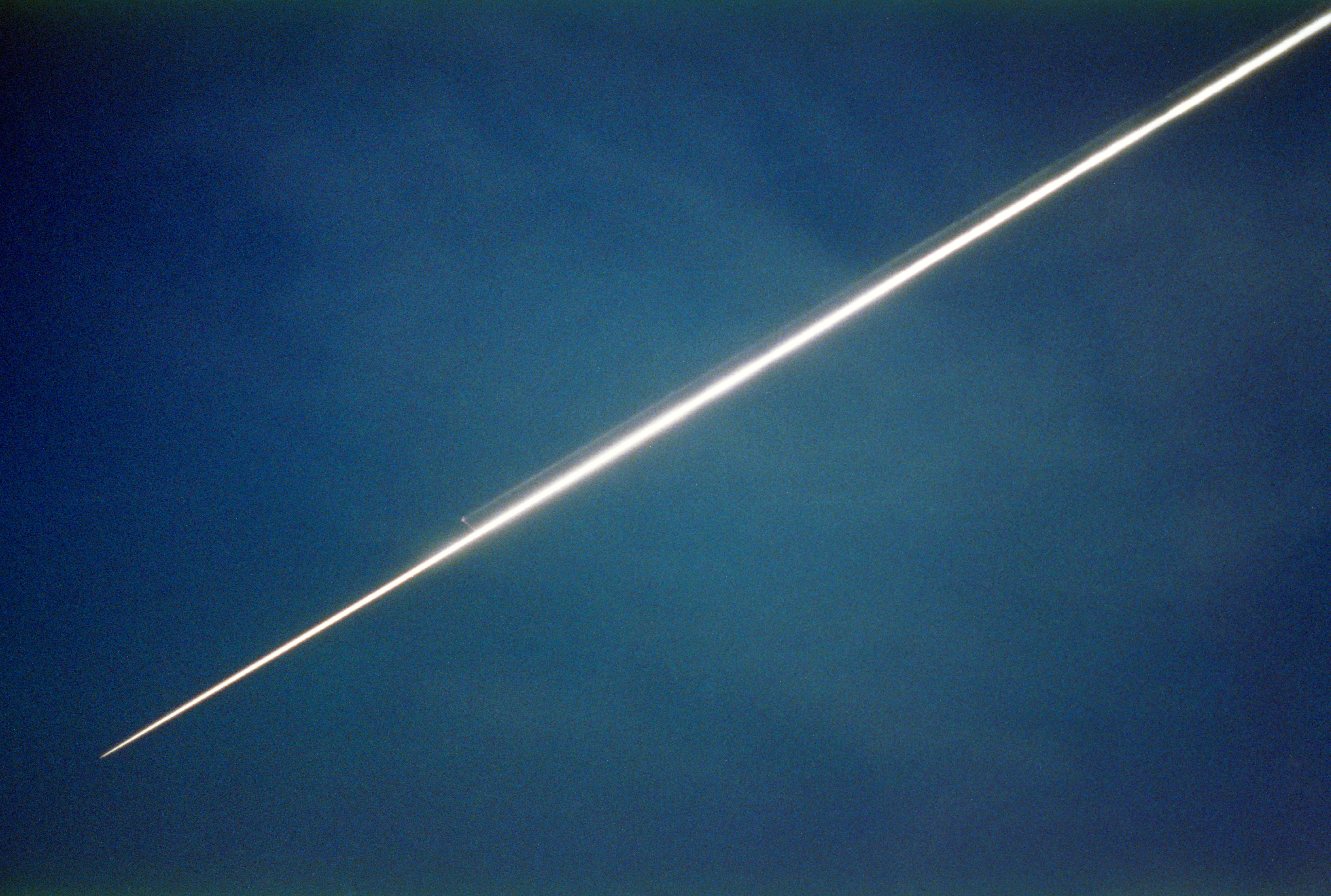 Discovery streaks over Houston on its way to land at NASA’s Kennedy Space Center