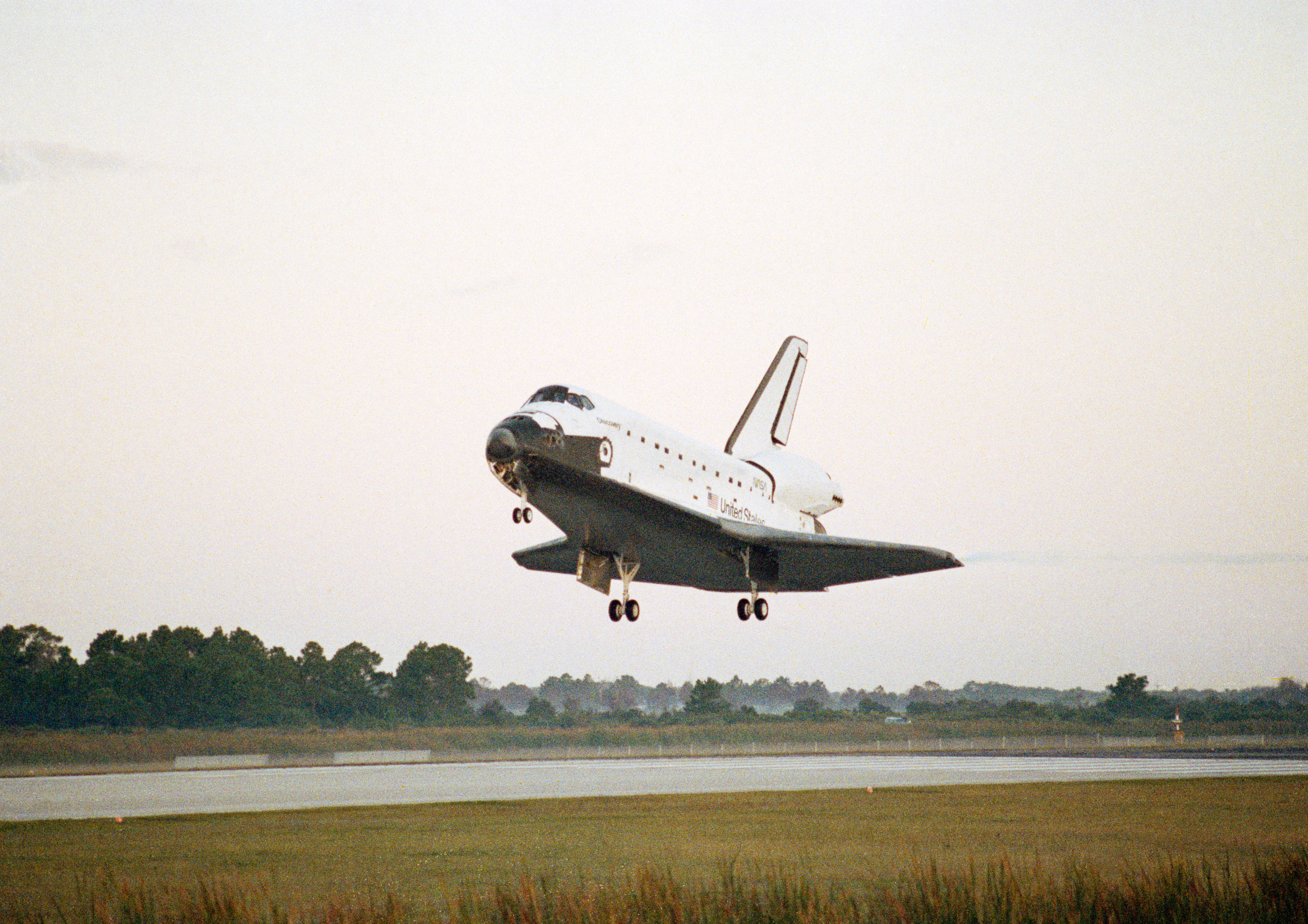 Discovery moments before touchdown at KSC