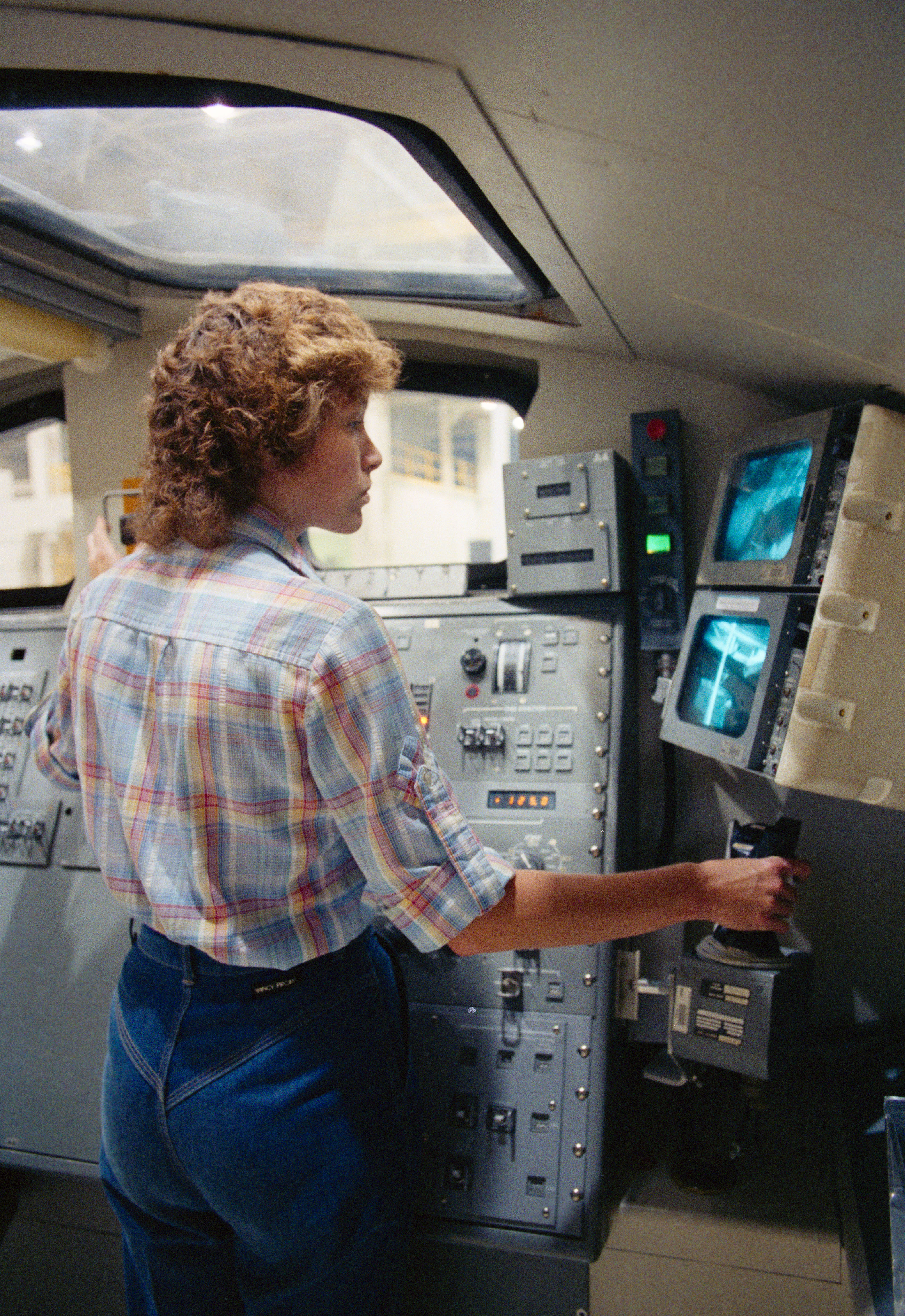 Astronaut Anna L. Fisher trains to use the Canadian-built Remote Manipulator System