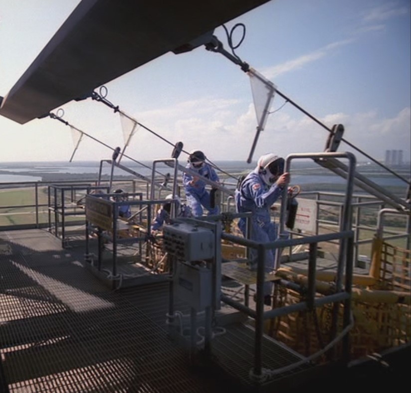 STS-51A astronauts practice rapid evacuation from the launch pad