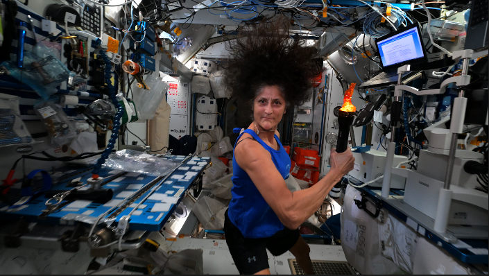 NASA astronaut Suni Williams shows off her strength during the ISS Olympics.