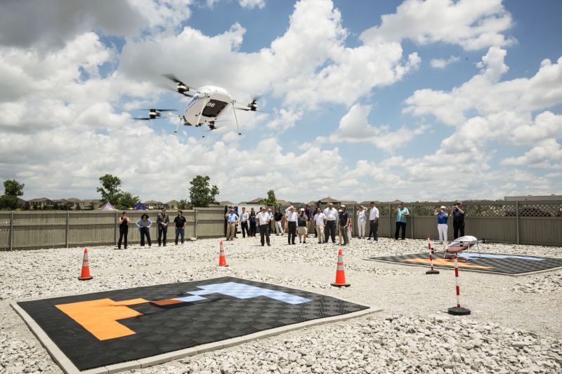 NASA, along with members of the FAA and commercial drone engineers, gather outside to view a drone demonstration flight by Wisk on May25, 2024.