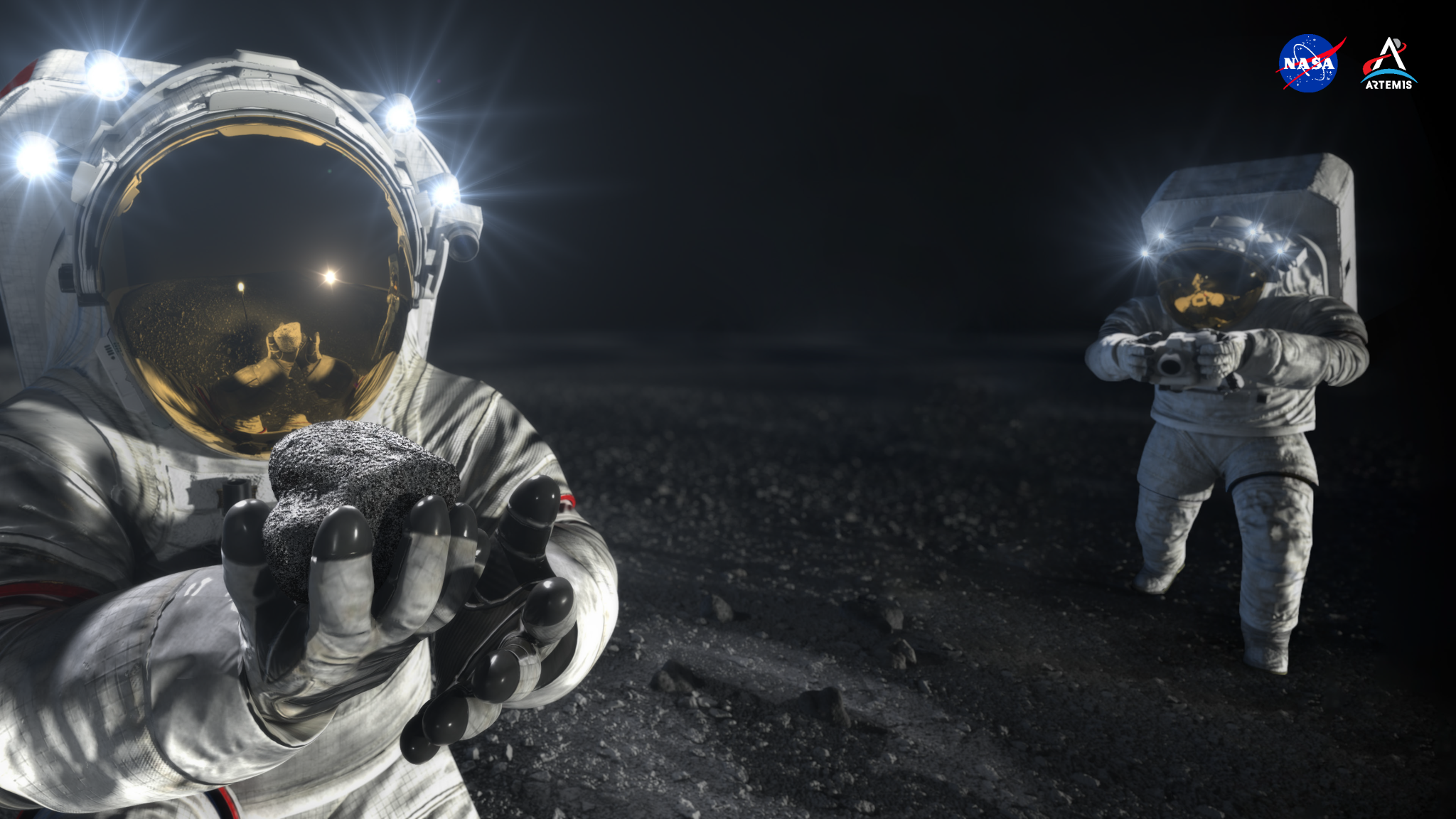 An artist’s concept shows two Artemis crew members wearing white spacesuits with large, square life-support system backpacks and round helmets with gold visors on the pebbled gray surface of the Moon. In the foreground, an astronaut holds out a palm-sized lunar sample toward the viewer. A few feet behind the astronaut in the foreground, another crew member uses a camera to take a snapshot aimed at the rocky surface. The scene is backdropped by a black night sky.