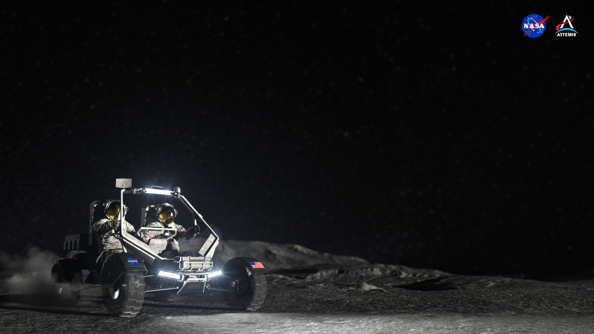 Driving into the frame at the left of the virtual background, this concept image shows the “Moon buggy” for NASA’s Artemis missions — the Lunar Terrain Vehicle (LTV) — occupied by two astronauts in white spacesuits and helmets with gold visors. This LTV concept has a silver-colored open metal frame, reminiscent of off-roading sport vehicles, along with deeply grooved tires for traction on the uneven lunar terrain. A NASA insignia decal is on the LTV frame above the left front tire, along with an American flag decal on the frame above the right front tire. In the background, the undulating lunar terrain framed by the pitch-black backdrop of space.