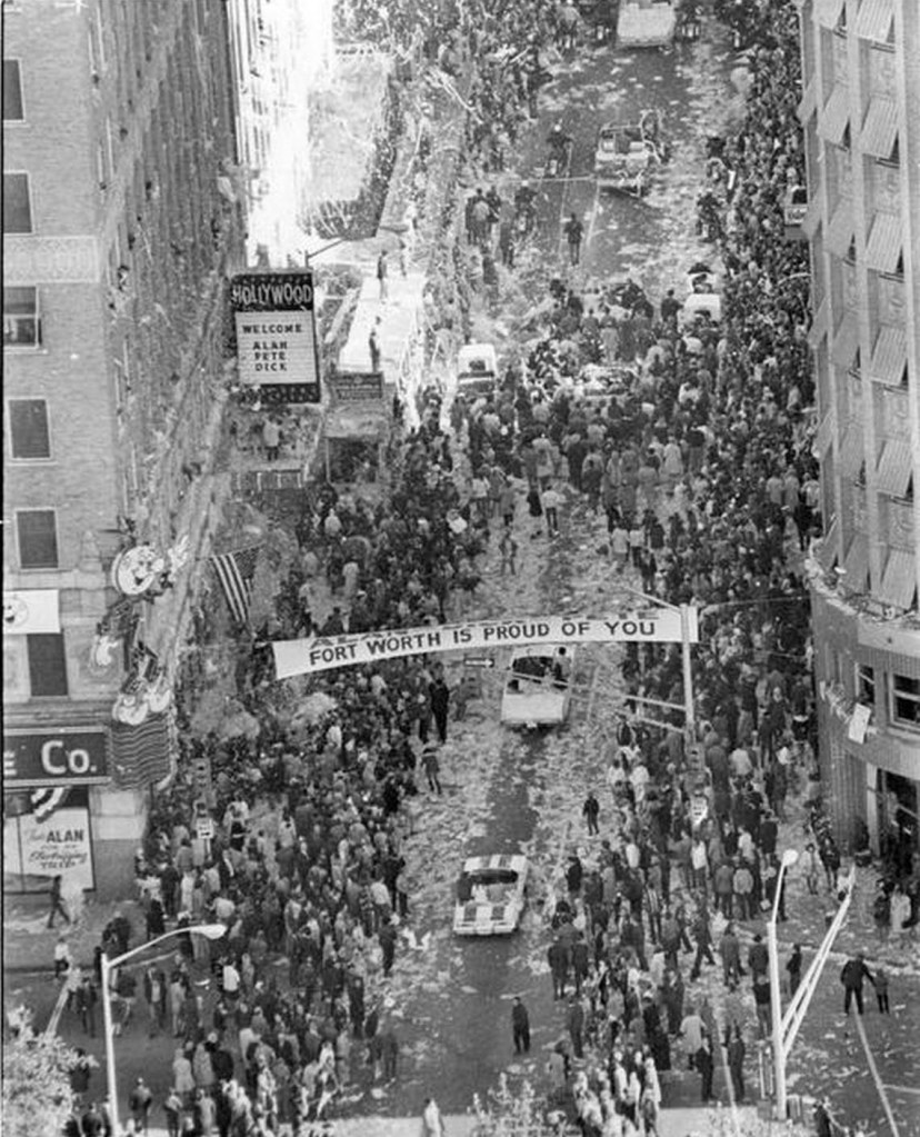 Black and white overhead street scene of a ticker tape parade.