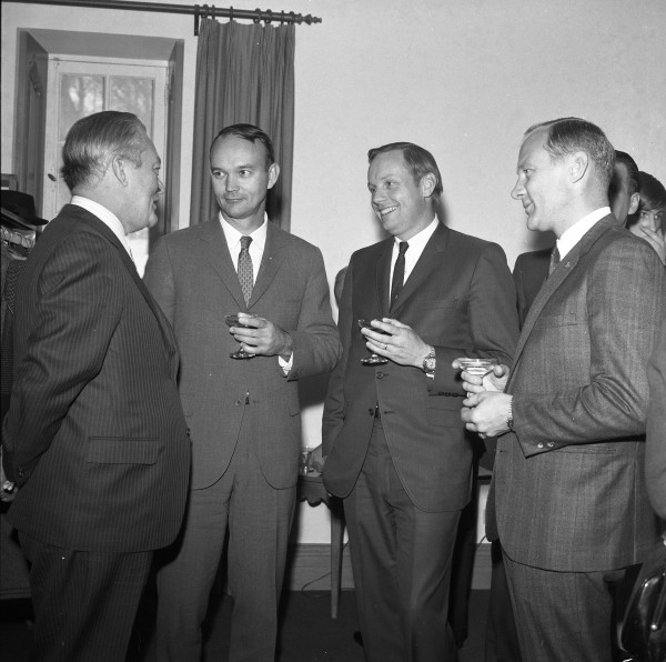 Black and white image of four men including the Apollo 11 astronauts in Canada.