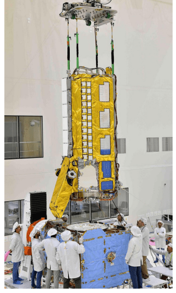 In June 2023, NISAR’s radar instrument payload and spacecraft bus were combined in an ISRO clean room facility in Bengaluru, India. Image credit: VDOS-URSC