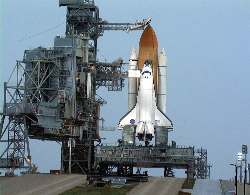 A space shuttle sitting on its launch pad