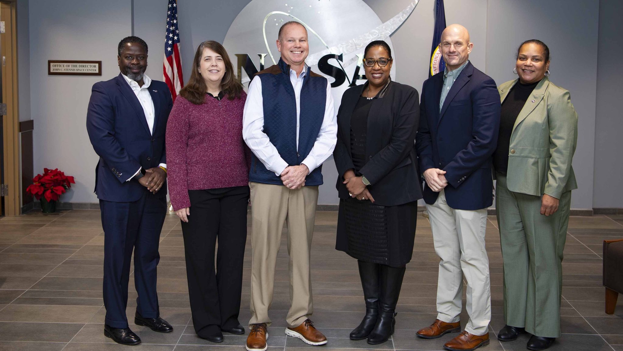 The NASA assistant administrator for procurement stands with leaders of NASA’s Stennis Space Center and the NASA Shared Services Center