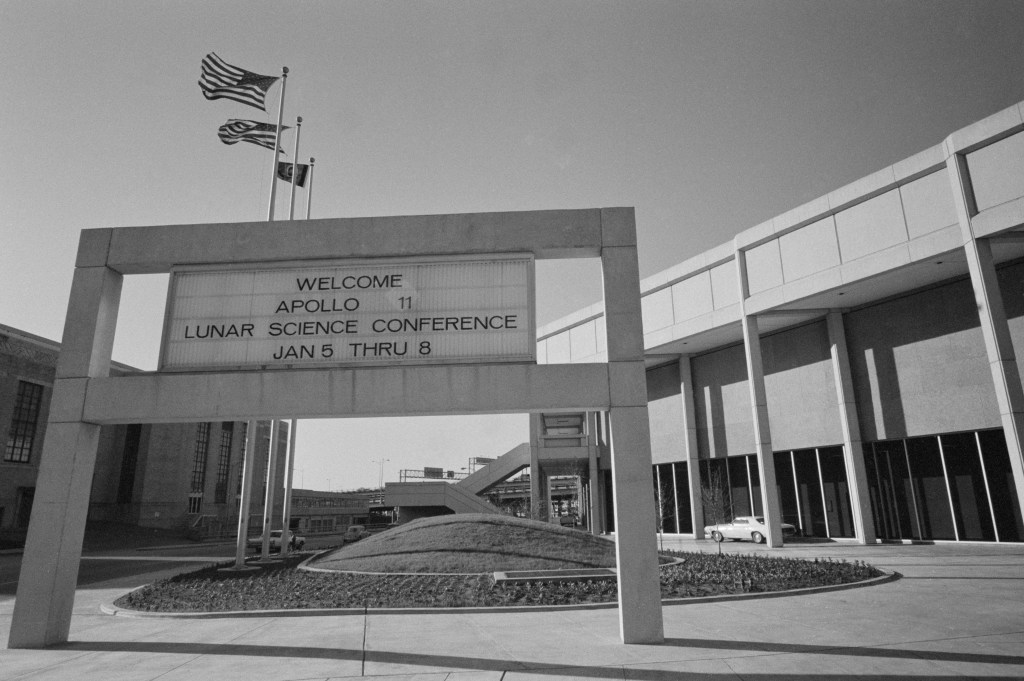 Black and white image of a welcome sign at a convention center reading: Welcome Apollo 11 Lunar Science Conference."