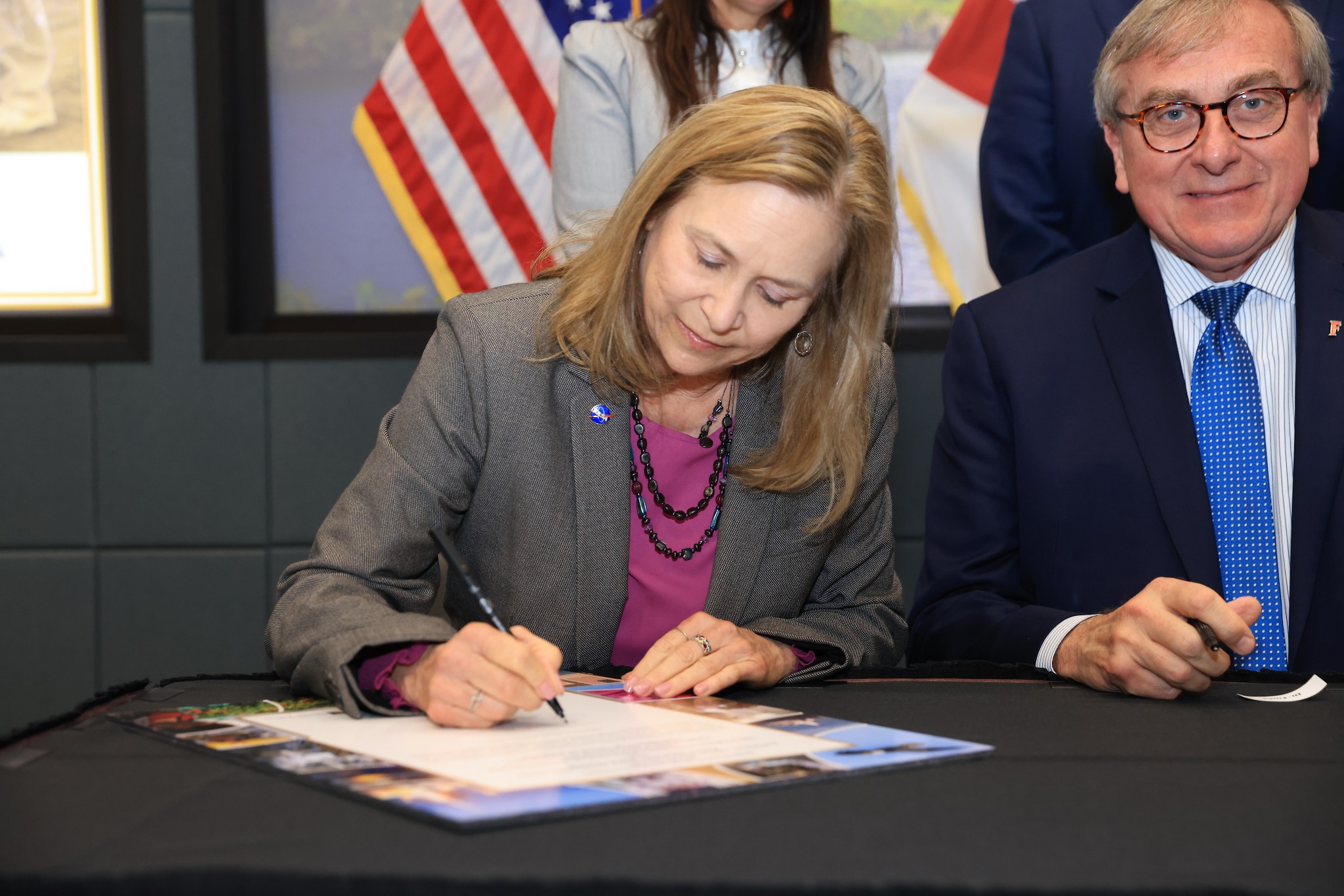 Kennedy Space Center Janet Petro signs a memorandum of understanding between Kennedy Space Center and the Florida University Space Research Consortium on Jan. 8, 2025. Comprised of the University of Florida, Embry-Riddle Aeronautical University, and University of Central Florida, the consortium was designated in 2024 as the state’s official space research entity, making Florida the only state with a university consortium affiliated with one of NASA’s centers. This critical milestone in a one-of-a-kind partnership to advance research, technology development, education, and communication between the spaceport and the state’s growing space industry.