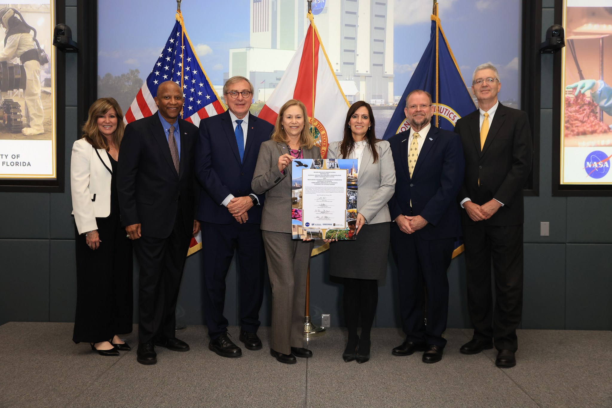 Kennedy Space Center Director and charter members of the Florida University Space Research Consortium signed a memorandum of understanding on Jan. 8, 2025. Comprised of the University of Florida, Embry-Riddle Aeronautical University, and University of Central Florida, the consortium was designated in 2024 as the state’s official space research entity, making Florida the only state with a university consortium affiliated with one of NASA’s centers. This critical milestone in a one-of-a-kind partnership to advance research, technology development, education, and communication between the spaceport and the state’s growing space industry. From left: Jennifer Kunz, Associate Director, Technical, Kennedy Space Center; Kelvin Manning, Deputy Director, Kennedy Space Center; Dr. Kent Fuchs, Interim President, University of Florida; Janet Petro, Director, Kennedy Space Center; Jeanette Nuñez, Florida Lieutenant Governor; Dr. Alexander Cartwright, President, University of Central Florida; Dr. Barry Butler, President, Embry-Riddle Aeronautical University.