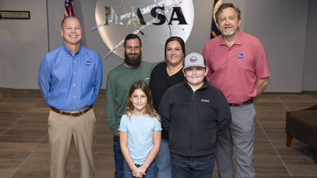 Cookbook author and culinary content creator Caroline Davis, popularly known as Mississippi Kween, and her family pose for a portrait the Center Director and Center Associate Director