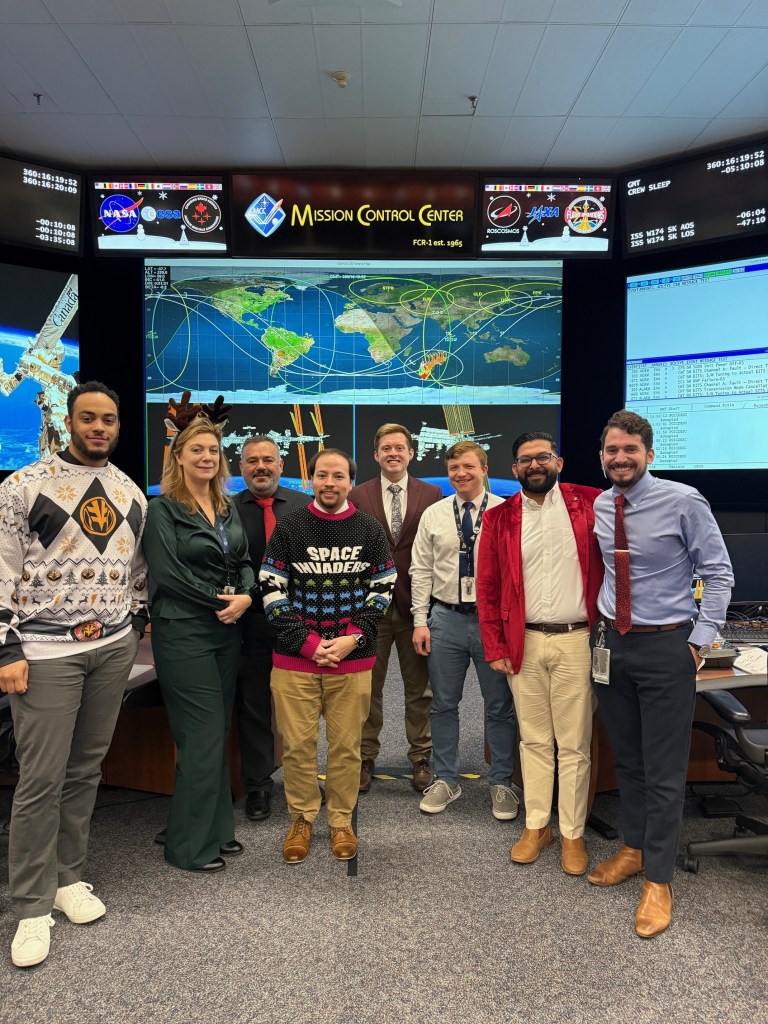 The MCC Orbit 2 team poses for a picture after decorating their cookies