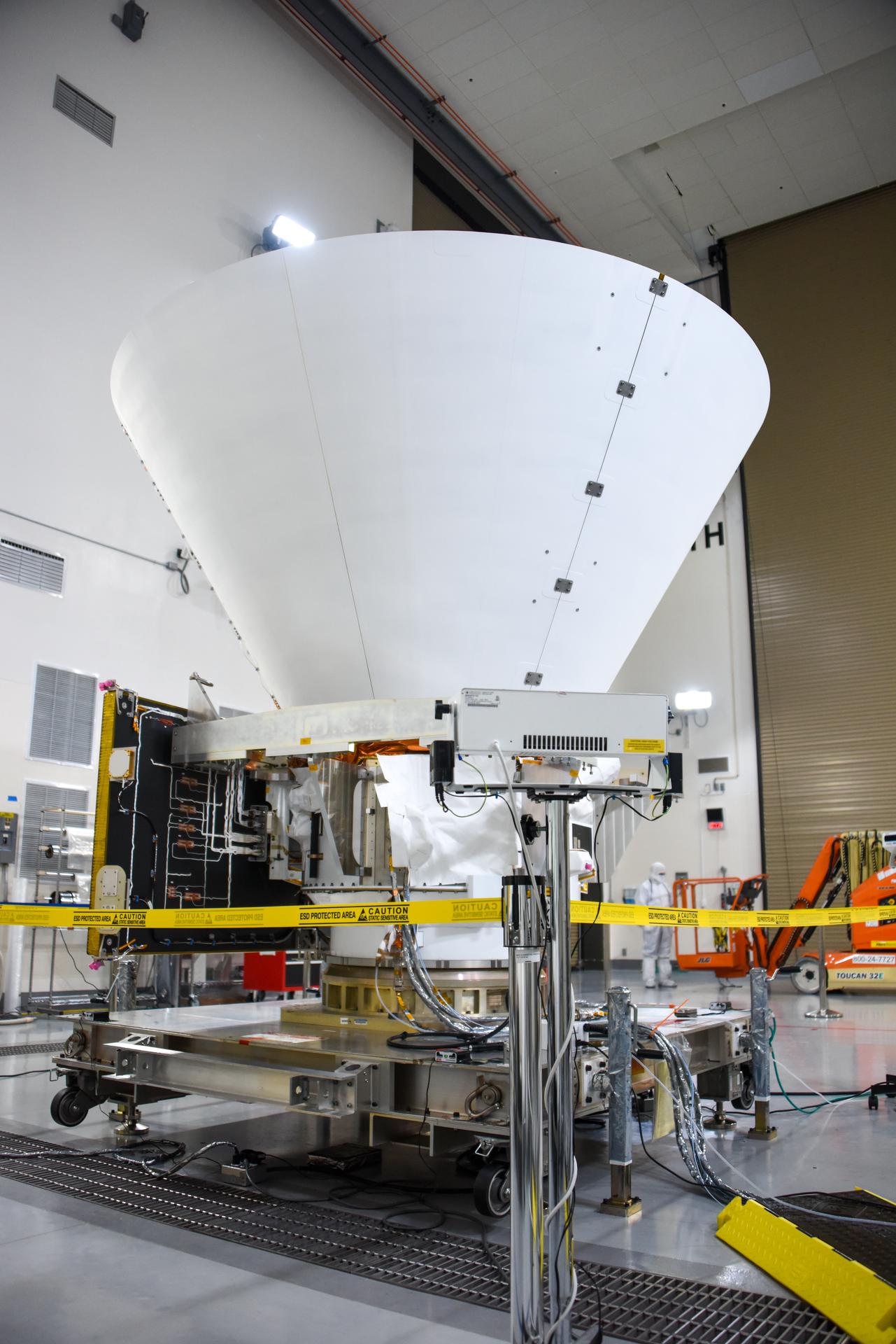 Caption: NASA’s SPHEREx is situated on a work stand ahead of prelaunch operations at the Astrotech Processing Facility at Vandenberg Space Force Base in California. The SPHEREx space telescope will share its ride to space on a SpaceX Falcon 9 rocket with NASA’s PUNCH mission. Credit: USSF 30th Space Wing/Christopher