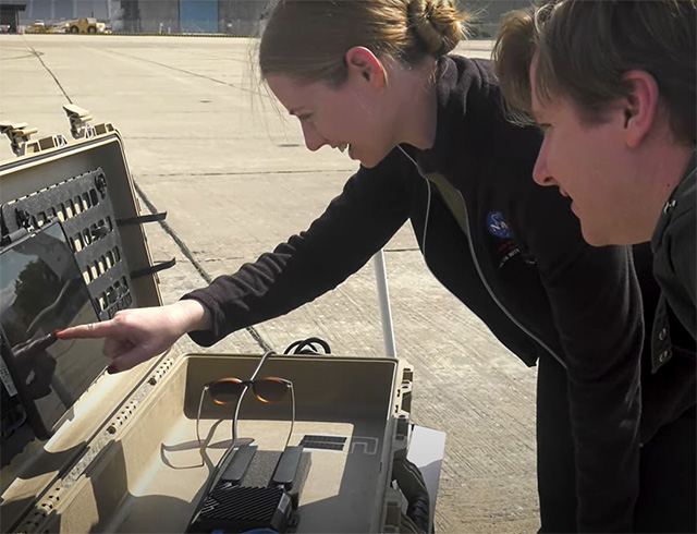 NASA aeronautics researcher Kathryn Chapman pointing at a screen