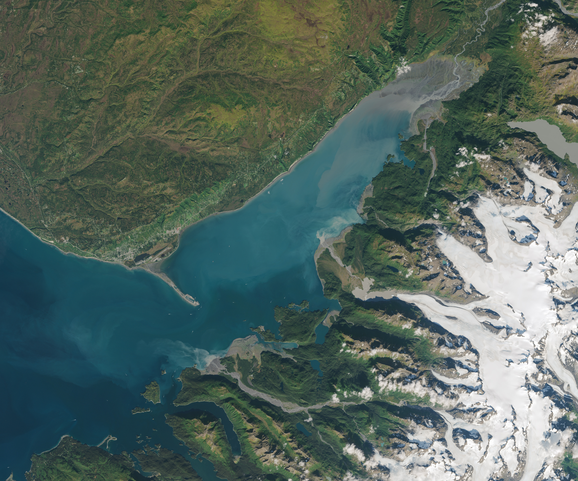 A view of Alaska's Kachemak Bay from the Landsat 8 satellite. The deep turquoise water is cloudy, thanks to plumes of sediment.