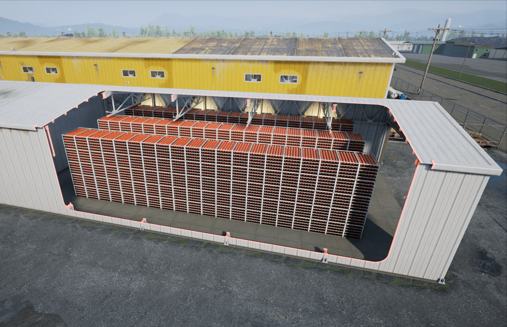 Cutout of a long, steel building that contains triple rows of batteries stacked on top of one another in a warehouse.