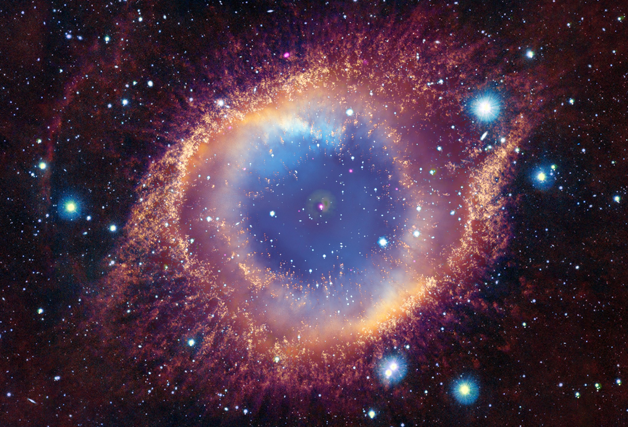 In about 5 billion years, our Sun will run out of fuel and expand, possibly engulfing Earth. These end stages of a star’s life can be utterly beautiful as is the case with this planetary nebula called the Helix Nebula. Astronomers study these objects by looking at all kinds of light. This series of images shows X-rays from Chandra, optical light data from Hubble, infrared data from the European Southern Observatory VISTA telescope, and ultraviolet data from GALEX of the Helix Nebula. At the center of the Helix is a white dwarf, a small dim star that remains after the star shed its outer layers.