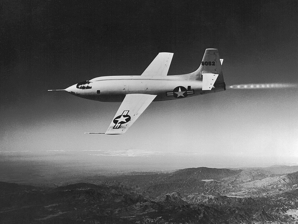 Black and white image of a rocket plane in flight (the X-1).