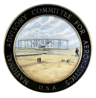 A circular seal, with a color drawing of the Wright Brothers first flight at Kitty Hawk, and National Advisory Council for Aeronautics written around the border.