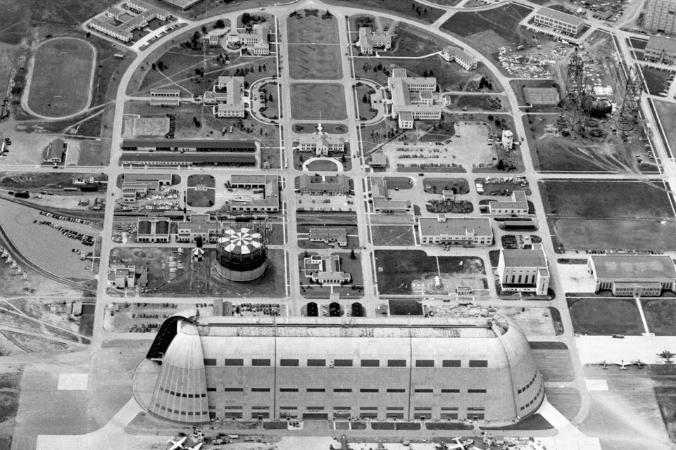 Black and white aerial view of a large facility with many buildings.