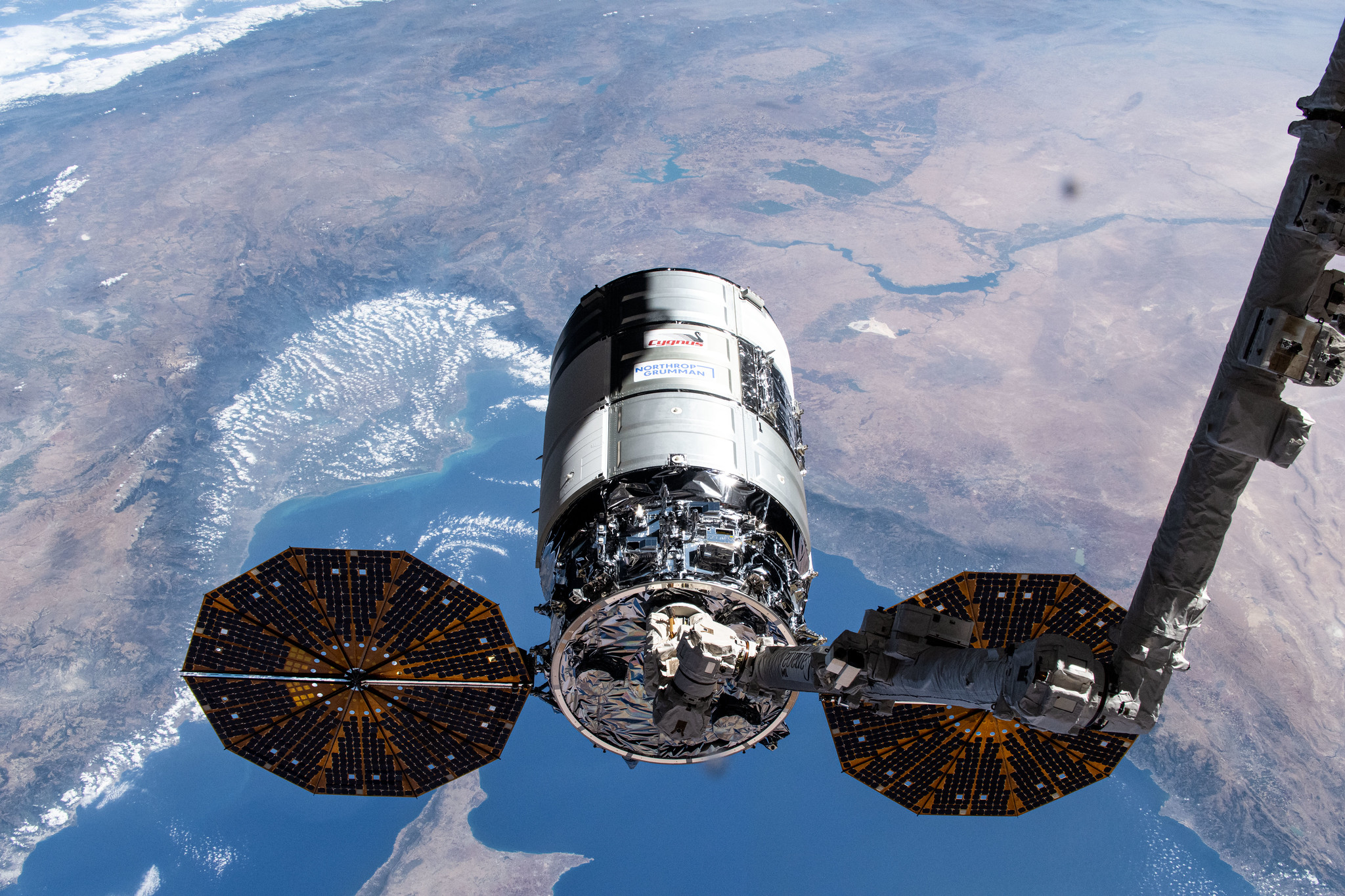 Northrop Grumman's Cygnus spacecraft is pictured in the grips of the Canadarm2 robotic arm shortly after its capture