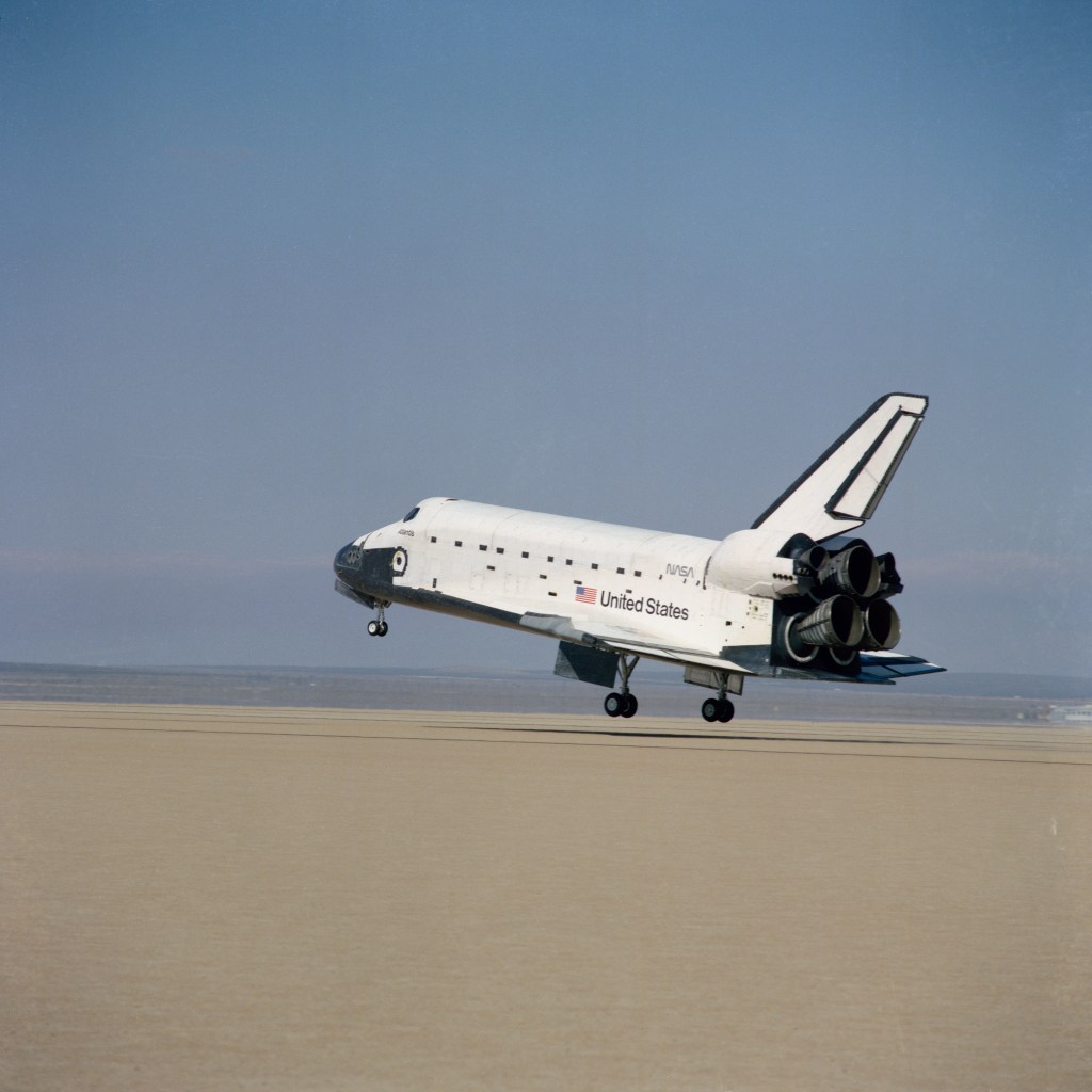 A space shuttle landing in the desert.