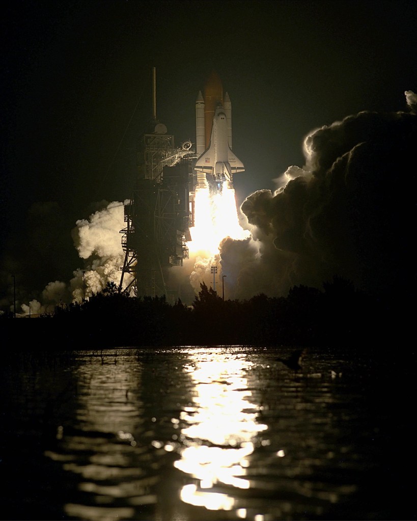 Nighttime view of a space shuttle launch