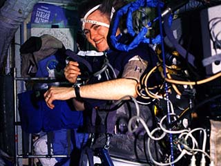 Astronaut Shannon Lucid is photographed using the Russian Lower Body Negative Pressure (LBNP) suit in the Mir space station Base Block.