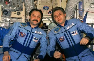 Portrait of Mir-21 cosmonauts Yuri Onufriyenko (right), mission commander and flight engineer Yury Usachev taken in the Mir space station Base Block.