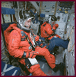 STS-91 crewmembers perform a fitcheck in their Launch and Entry Suits (LESs) prior to thei mission: Mission Specialist Valery Ryumin and Mission Specialist Franklin Chang-Diaz in the middeck of the Building 9 Shuttle mock-up