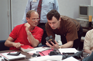 Dezhurov and Thagard practice using a bar-code reader during medical operations training at JSC